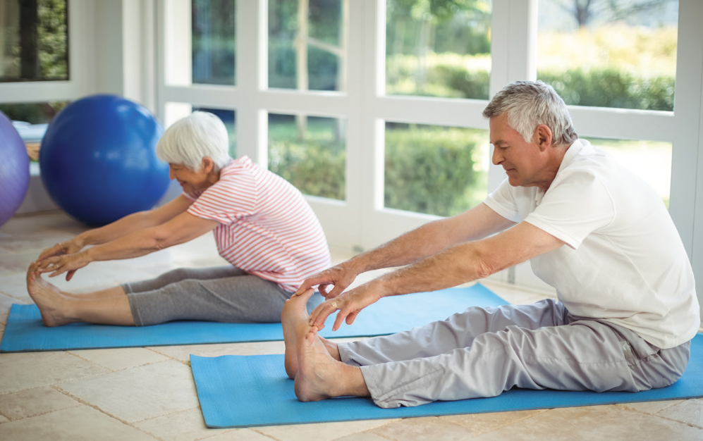 Two Older Adults Participating in Yoga