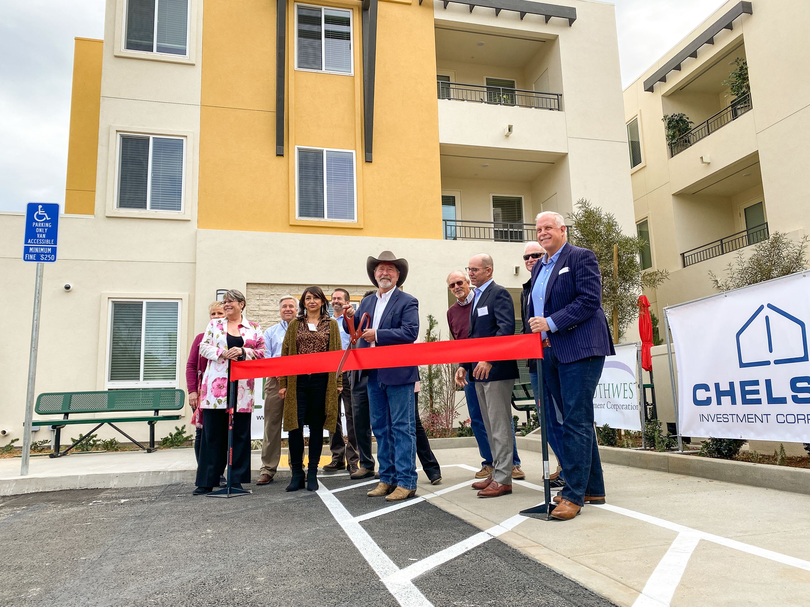 Mayor Vaus and other leaders getting ready to cut the ribbon for the grand opening